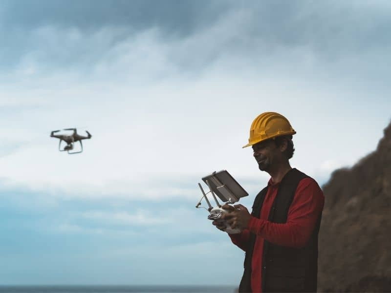 Drone operator mapping rugged desert terrain for Drone LiDAR Mapping before access and development planning.